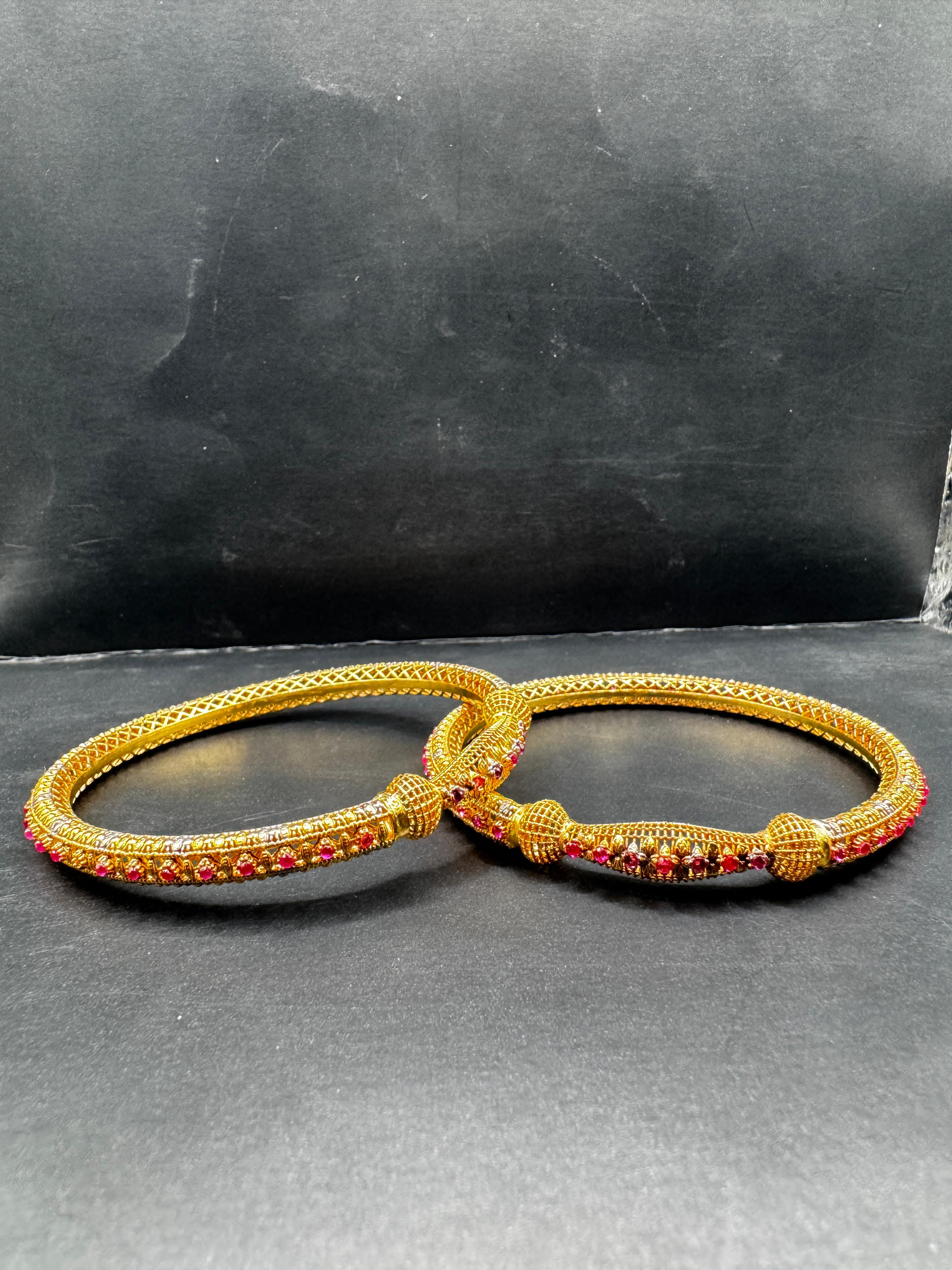 Elegance Gold-Plated Bangles with Red Stone Accents